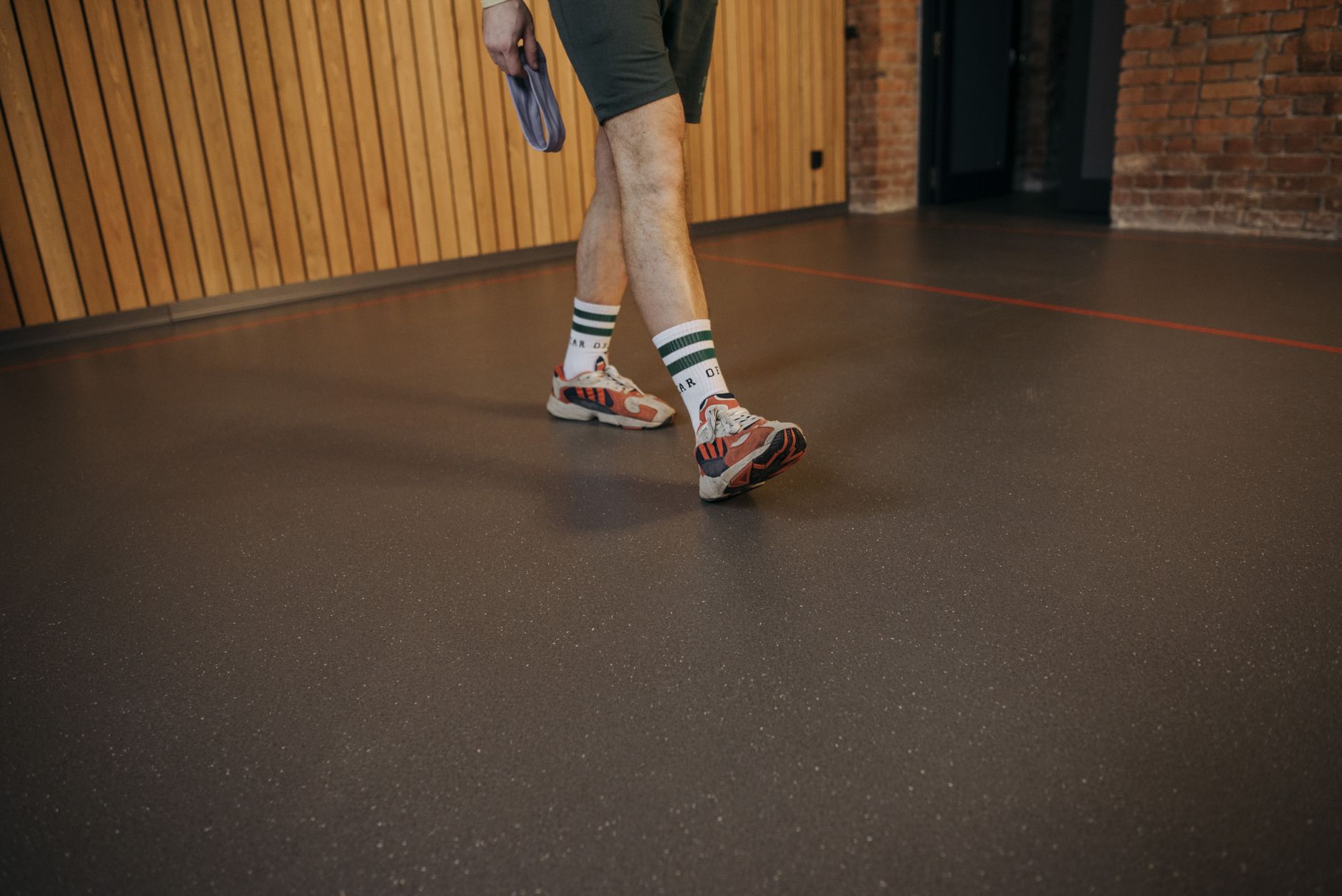 Person walking across a smooth coated indoor floor